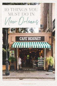 the front entrance to a cafe with green and white awnings on it's side