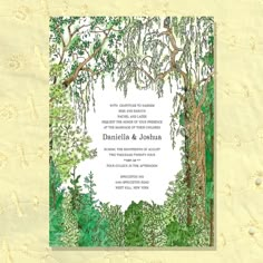 a wedding card with an image of trees and leaves on it, in the middle of a