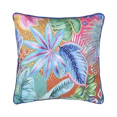 an orange and blue pillow with tropical leaves on it