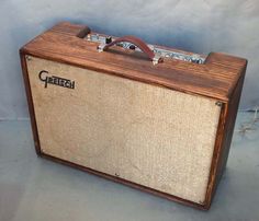 an old wooden amp sitting on top of a table