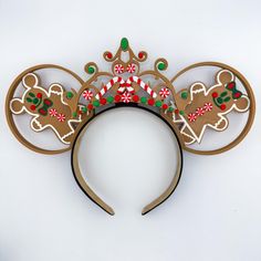 Live your best Gingerbread life with these gorgeous Christmas ears!  *All of my ears are interchangeable using a industrial velcro-like snap system. They are sturdy, but easy to change out! Additional bows/tiaras can be purchased separately.* I can also make them permanent- just leave a message at checkout!  My ears are all 3d printed and placed on a 1" black comfort fit headband. If you have thinner hair, I also have an add on of a rubber teeth insert to help hold them into place in a separate listing!  These can be made custom with any bow combination! Just add a message to your order to let me know what you prefer. If no message is left- I will send what is shown! If you have any questions, please send a message and I'd love to help you customize! 3d Gingerbread, Gingerbread Castle, Castle Christmas, Cinderella Castle, Gorgeous Christmas, 3d Christmas, Disney Ears, Mickey Ears, Christmas Gingerbread