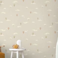 a child's room wallpaper with hot air balloons in the sky and clouds