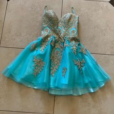 It’s A Turquoise Color With Gold Details Through Out The Dress! It’s Brand New Dancing Queen Dresses, Queen Dresses, Dancing Queen, Homecoming Dress, Turquoise Color, Gold Details, Dress Brands, Blue Gold, Homecoming Dresses