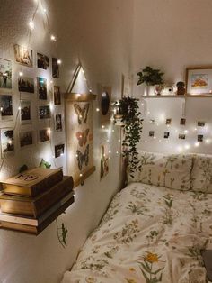 a bed with white sheets and lights on the wall