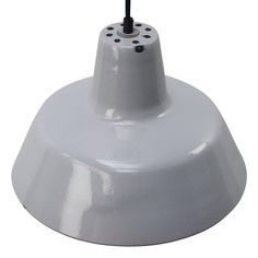 a white light that is on top of a table with a black cord attached to it