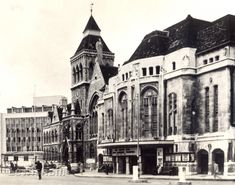 an old black and white photo of buildings