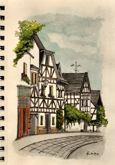 a drawing of an old european town with half - timber buildings