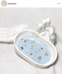 the toothbrush holder is decorated with cartoon images