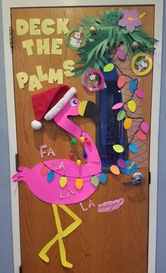 a door decorated with pink flamingos and decorations