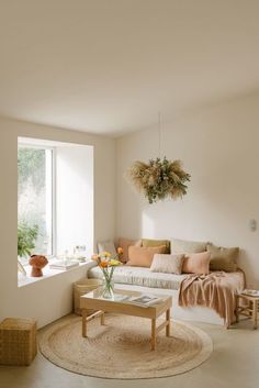 a living room filled with furniture next to a window