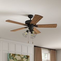 a ceiling fan with three lights hanging from it's blades in a living room