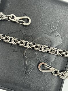 Wallet chain made out of 16 gage stainless steel in the Byzantine weave.  This will be a custom order and be up to 25 inches in length.  I can add 1 clip and 1 split ring or 2 clips. Luxury Silver Wallet On Chain With Chain Strap, Luxury Women's Wallet On Chain With Silver-tone Hardware, Luxury Formal Wallet On Chain With Metal Logo, Luxury Leather Wallet On Chain With Chain Detail, Wallet Chain, Split Ring, Christmas 2024, Money Clip, Purse Wallet