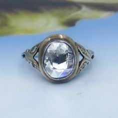 an antique ring with a large stone in the center