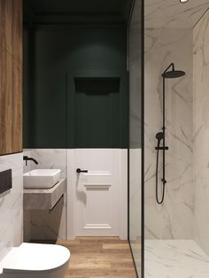 a bathroom with marble walls and flooring next to a walk - in shower stall