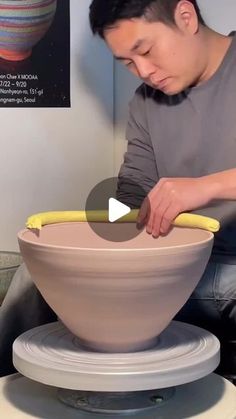 a man is working on a large bowl