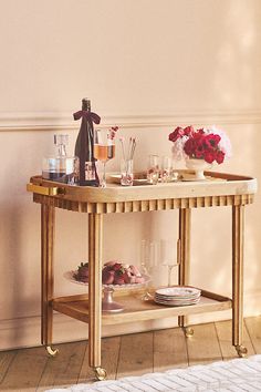 a wooden table with plates and glasses on it