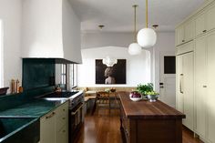 the kitchen is clean and ready to be used as a dining room or living room