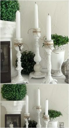 white candles are sitting on top of a mantle with potted plants in the corner