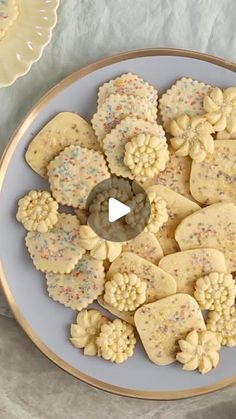 a white plate topped with cookies and sprinkles on top of a table