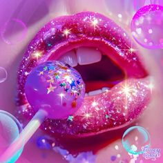 a close up of a pink lip with glitter on it and a lollipop