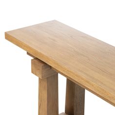 a close up of a wooden table with one leg raised and the other leg down