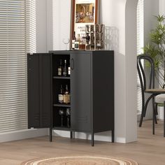 a black cabinet with bottles and glasses on it in a living room next to a rug