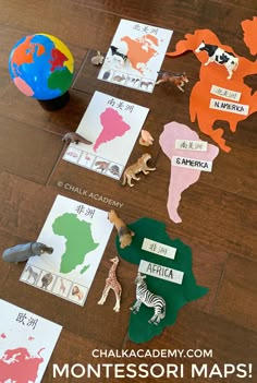 children's montessori map with animals and letters on the floor next to them