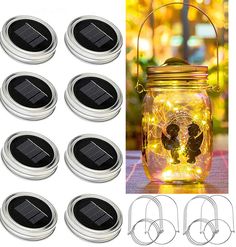 six solar powered mason jars with fairy lights in them and the lids open to reveal angel images