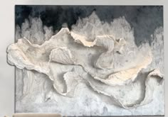 a large white and black painting on the wall