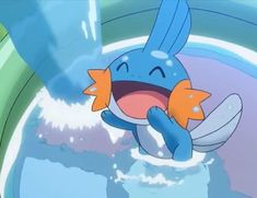 a blue and orange pokemon character with its mouth open