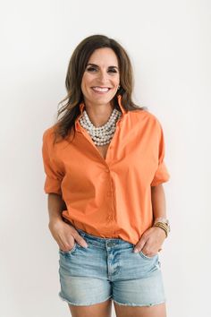 This burnt orange blouse is a versatile and chic top that adds a fresh pop of game day color to any outfit. Whether dressed up or down, it is the perfect addition to your wardrobe.. Crisp burnt orange-hued cotton Oversized fit (Recommend sizing down, see fit notes below) Exaggerated classic cuff Ruffled stand-up collar Button front Ruffle Collar Shirt, Chloe Dress, Romper And Jacket, Orange Blouse, Jumpsuit Jacket, Ruffle Shirt, Chic Top, Ruffle Collar, Collar Shirt