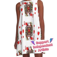 a woman wearing a white dress with red hearts and playing cards on the back,