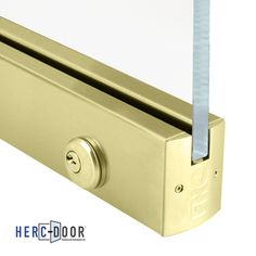 an image of a door handle with glass on the top and bottom part in gold