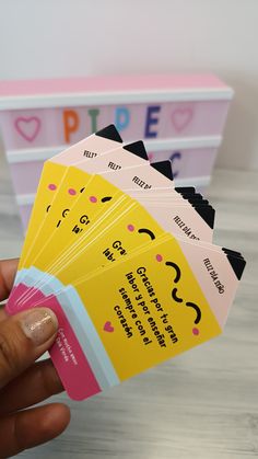 a person holding up five small business cards with the word peple written on them