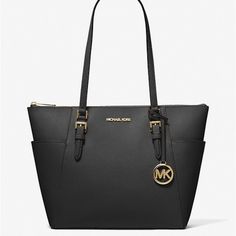 New With Tags 100% Authentic Michael Kors Charlotte Large Shoulder Tote Black With Gold Tone Hardware Saffiano Leather Mk Logo Charm Zip Closure Exterior Details: 2 Side Open Pockets Interior: Back Zip Pocket And 2 Front Slip Pockets Handles Drop 10” Dust Bag Not Included Length: 11” (Bottom) - 15" (Top) Height: 10" Depth: 4 1/2" Black Tote, Purses Michael Kors, Shoulder Tote, Michael Kors Black