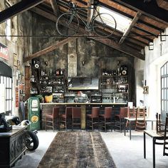 an old fashioned bar with lots of chairs and tables