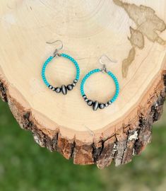 Turquoise Navajo style hoop earrings. Handmade with glass turquoise seed beads, Navajo style faux pearls, and stainless steel wire. The faux pearls give these earrings the beautiful style of Navajo without the weight. They are super light and petite. Perfect for a minimalist western or boho look.  Length 2 inches Width 1 1/4 inches **Earrings Only** Please message me if you have any questions. Thank you for visiting my shop! Happy Hanging! Adjustable Turquoise Hoop Earrings For Festival, Southwestern Turquoise Nickel-free Hoop Earrings, Turquoise Southwestern Nickel-free Hoop Earrings, Artisan Turquoise Hoop Earrings, Southwestern Turquoise Hoop Earrings Nickel Free, Turquoise Nickel-free Small Hoop Beaded Earrings, Small Hoop Turquoise Beaded Jewelry, Artisan Nickel-free Turquoise Hoop Earrings, Turquoise Beaded Earrings With Small Hoop