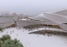 an aerial view of people walking and sitting in front of a building with curved roof