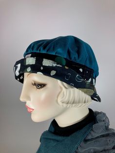 "Lorraine" is so pretty and versatile. This black, white, camel and teal fabric cloche hat is handmade and one of a kind. It's a nice transitional hat; not too heavy and not too light. The teal top is narrow wale corduroy. The brim is a pretty plaid wool that was upcycled from a thrift store skirt. The band and under-brim is a cool abstract dot and square cotton fabric. The asymmetrical brim rolls upward all around. It's the type of brim that you can play around with and get lots of different sh Adjustable Blue Cloche Hat With Flat Brim, Adjustable Blue Cloche Hat, Handmade Casual Cloche Hat, One Size, Handmade Vintage Cloche Hat, Vintage Wool Cloche Hat, London In March, Winter Bucket Hat, Gatsby Hat, Travel Hat