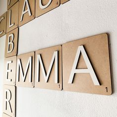 the letters are made out of cardboard and placed on the wall