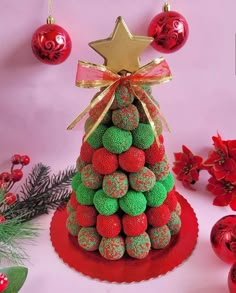 a christmas tree made out of chocolate covered strawberries and topped with a gold star