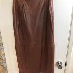 Euc. Beautiful Brown Leather Skirt, Size 5/6 Real Leather, Back Zip With Top Snap Waist Approx. 12.5", Hips Approx. 17" Length Approx. 31.5", Back Kickpleat Approx. 10.5" This Is An Elegant Skirt. Wear It With Silk Blouse Or A Sloppy Pullover No Returns Brown Leather Skirt, Elegant Skirt, Women Skirts Midi, Silk Blouse, Chocolate Brown, Real Leather, Leather Skirt, Brown Leather, Midi Skirt