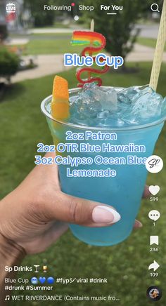 someone holding up a blue drink in their hand with the caption's below it