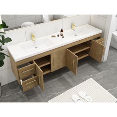 a bathroom vanity with two sinks and drawers