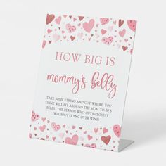 a card that says how big is mommy's belly? with hearts all over it