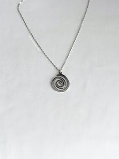 A fun, vortex necklace featuring a spiral charm on a 2mm rolo chain. An absolute essential in every jewelry collection. Our chains are 100% stainless steel and hypoallergenic so they won't rust, tarnish, or turn your neck green. - Water resistant - Lobster clasp closure - Pendant size: ~22mm - Stainless steel chain + pendant - Select desired size / color at checkout Swirl Necklace, Spiral Necklace, Rolo Chain, Belly Rings, Birthday Present, Chain Pendants, Stainless Steel Chain, Silver Necklaces, Ring Earrings