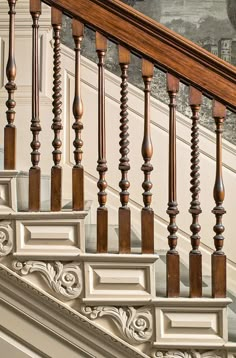 an old wooden staircase with handrails and wood balconies