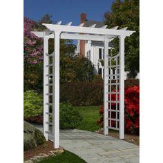 an outdoor white arbor with red fire hydrant