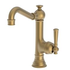 an antique brass faucet with two handles