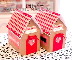 two small cardboard houses with hearts on them